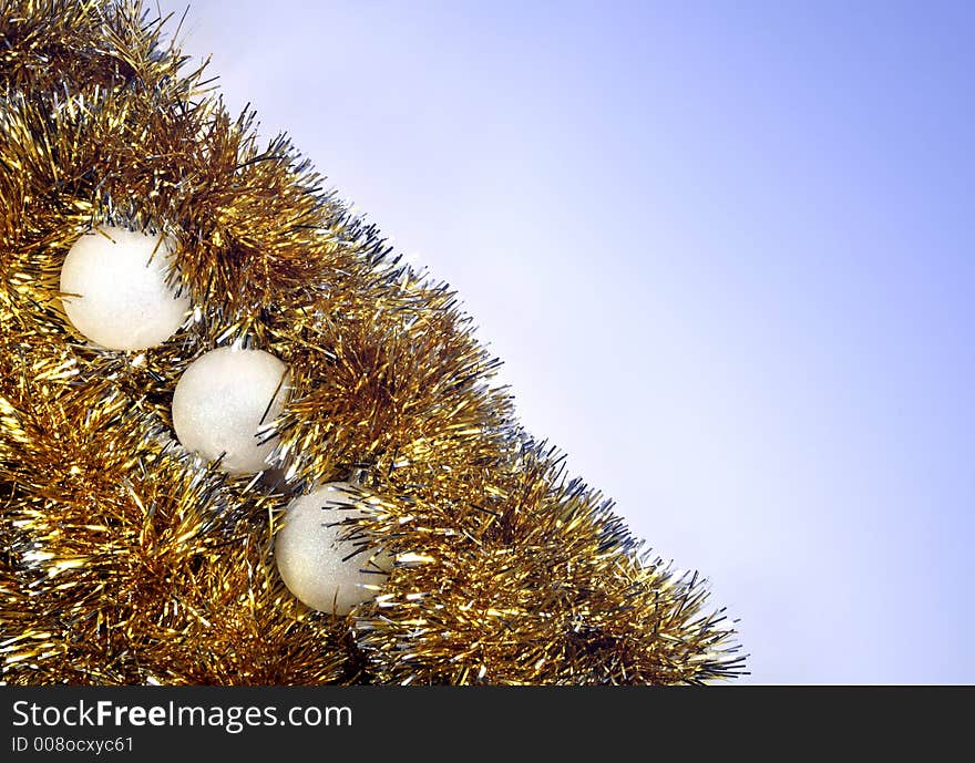 Christmas tinsel on blue background