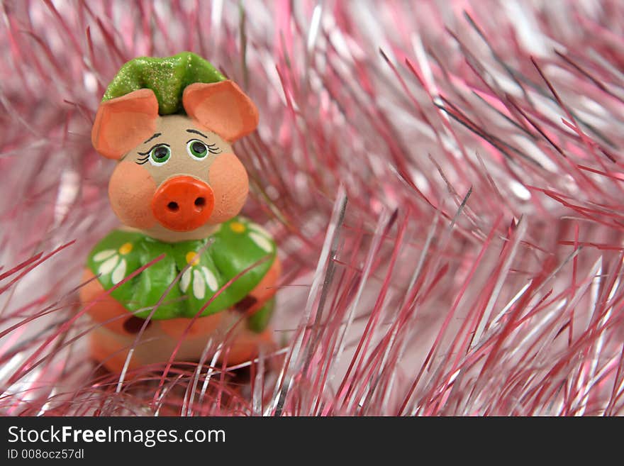 Piggy on christmas tinsel background