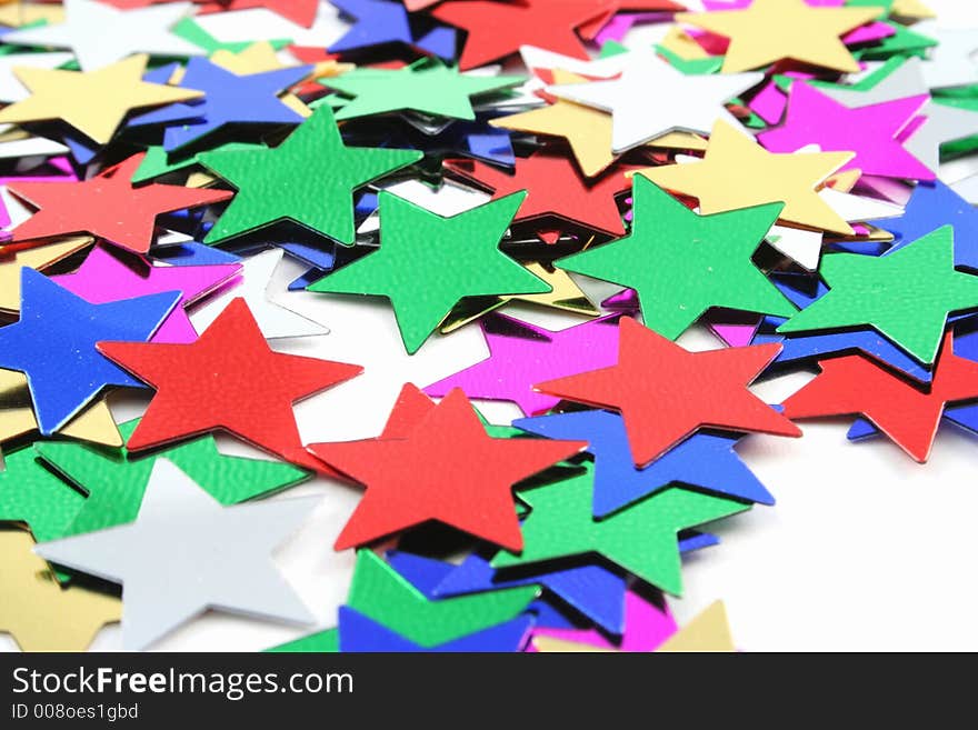 Silver and Gold conefetti stars on a white background. Silver and Gold conefetti stars on a white background