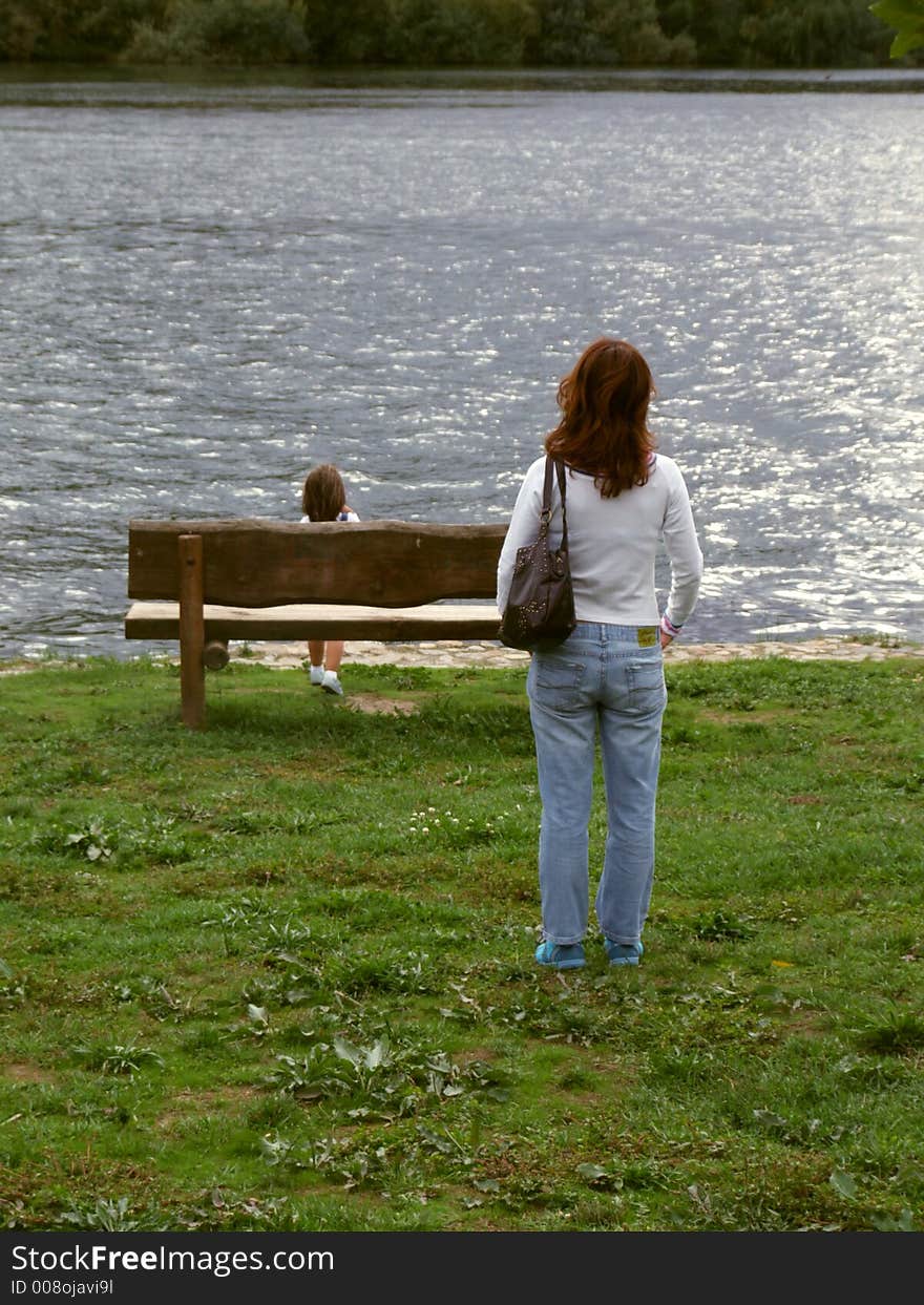 Mother and daughter at the riverside. Mother and daughter at the riverside