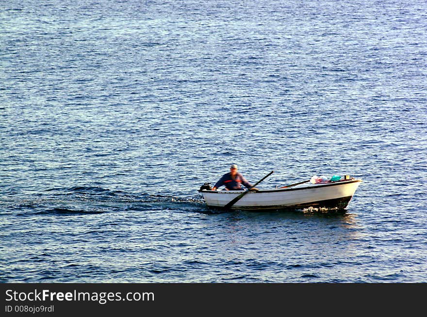 Fisherman on a small boat. Fisherman on a small boat