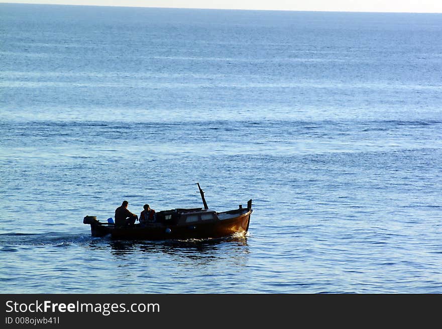 Fisherman's on a small boat. Fisherman's on a small boat