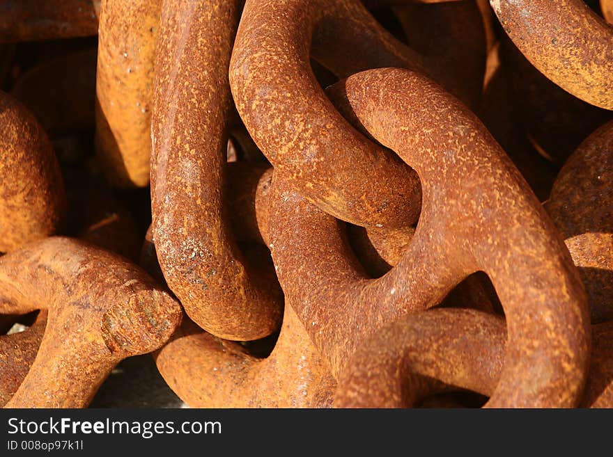 In a harbor in denmark a rusted chain