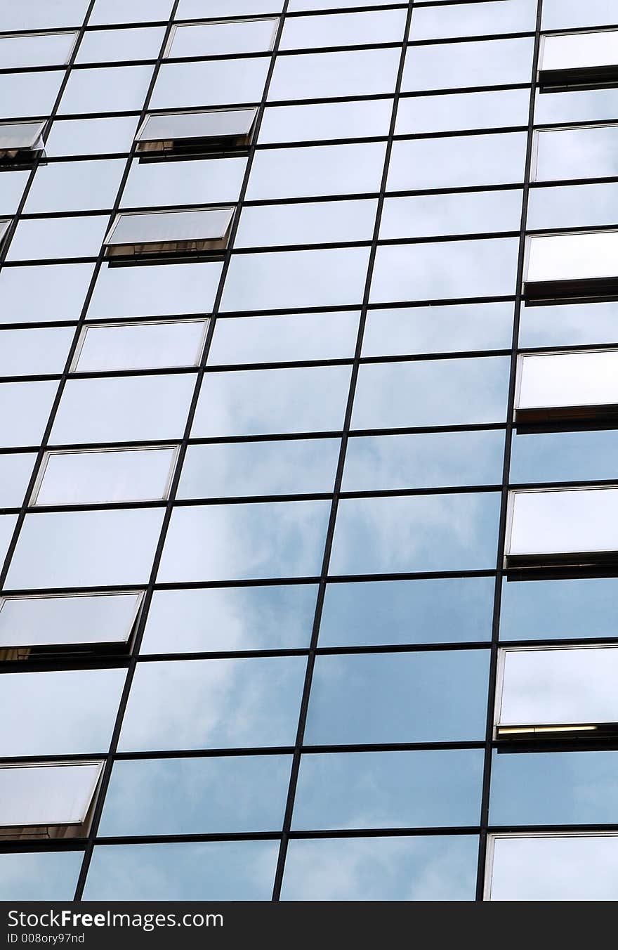 Glass front building with open windows.