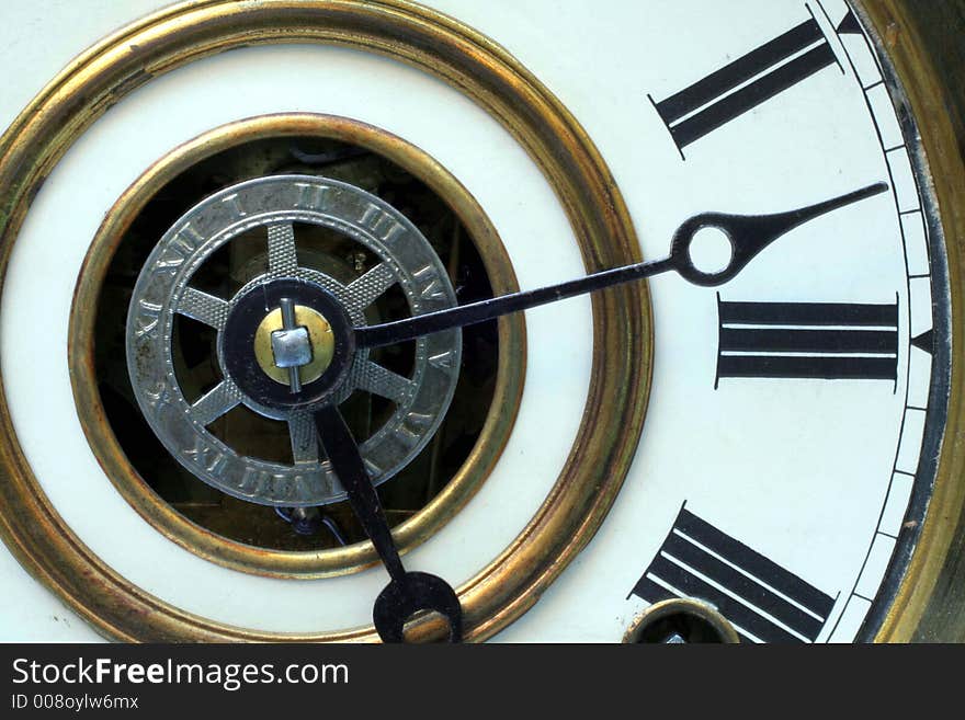 This is a close up image of an antique clock face.