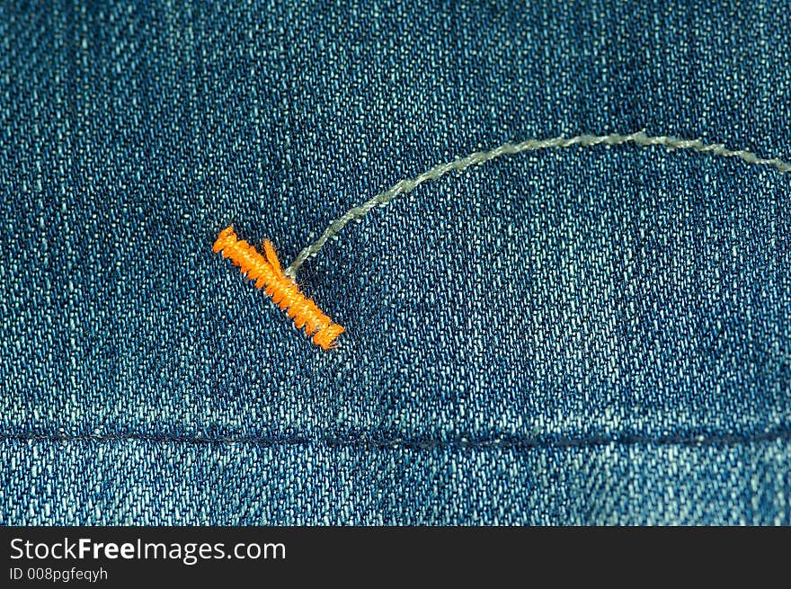 Detail shot of a used blue jeans