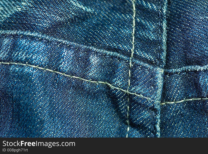 Detail shot of a used blue jeans