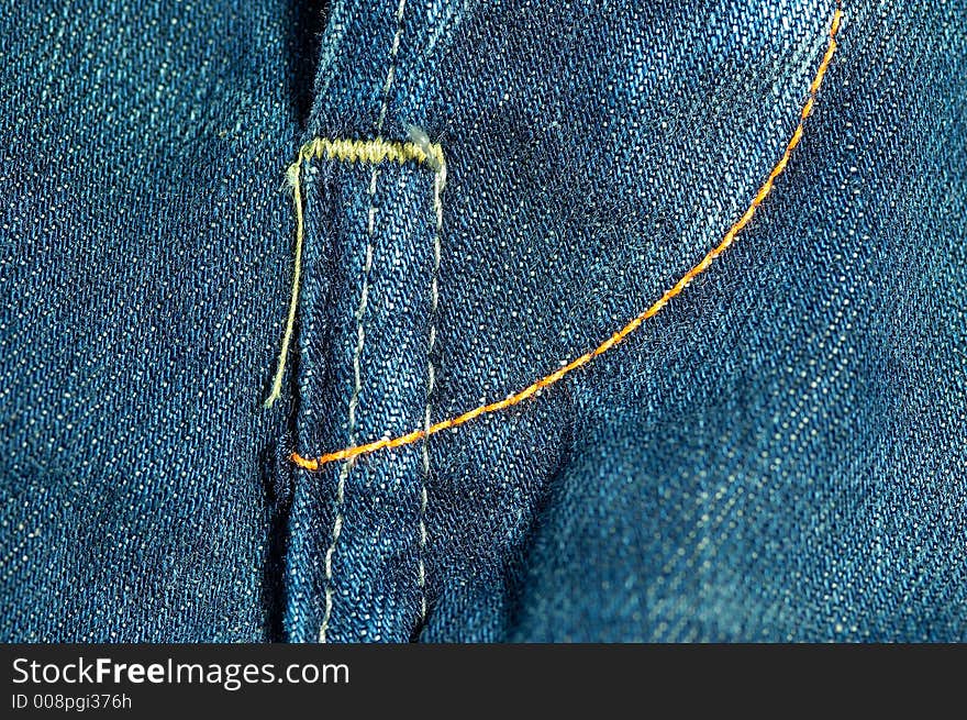 Detail shot of a used blue jeans