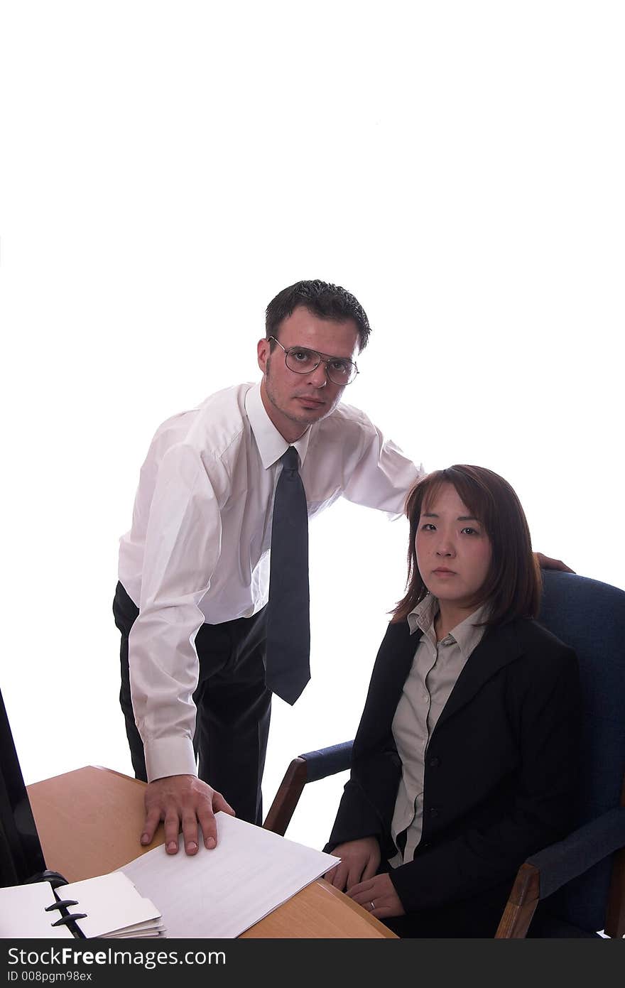 Young asian and american co-workers look at the camera. Young asian and american co-workers look at the camera