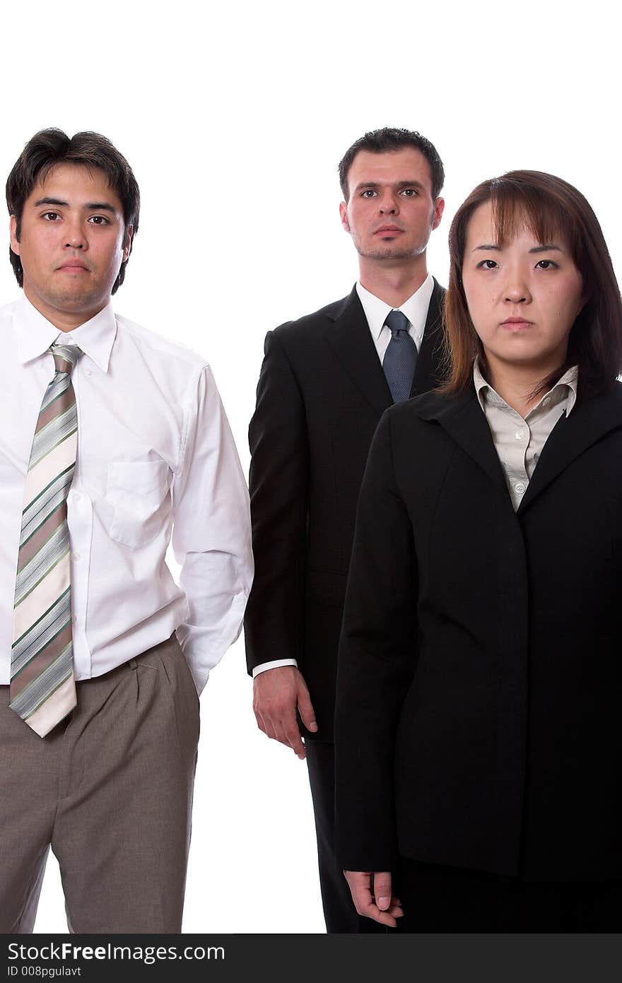 Young asian and american co-workers look into the camera. Young asian and american co-workers look into the camera