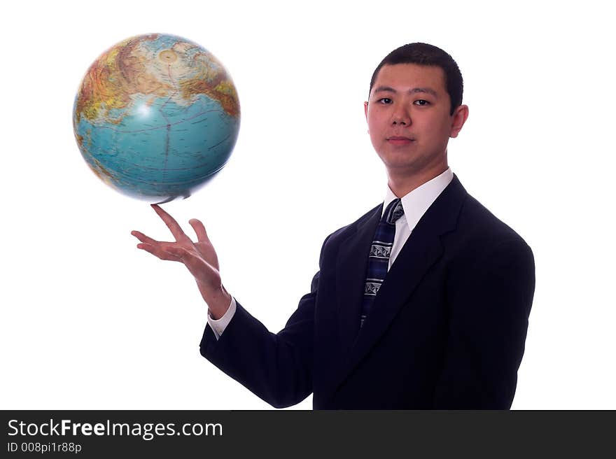 Young asian businessman spinning a globe on his finger. Young asian businessman spinning a globe on his finger