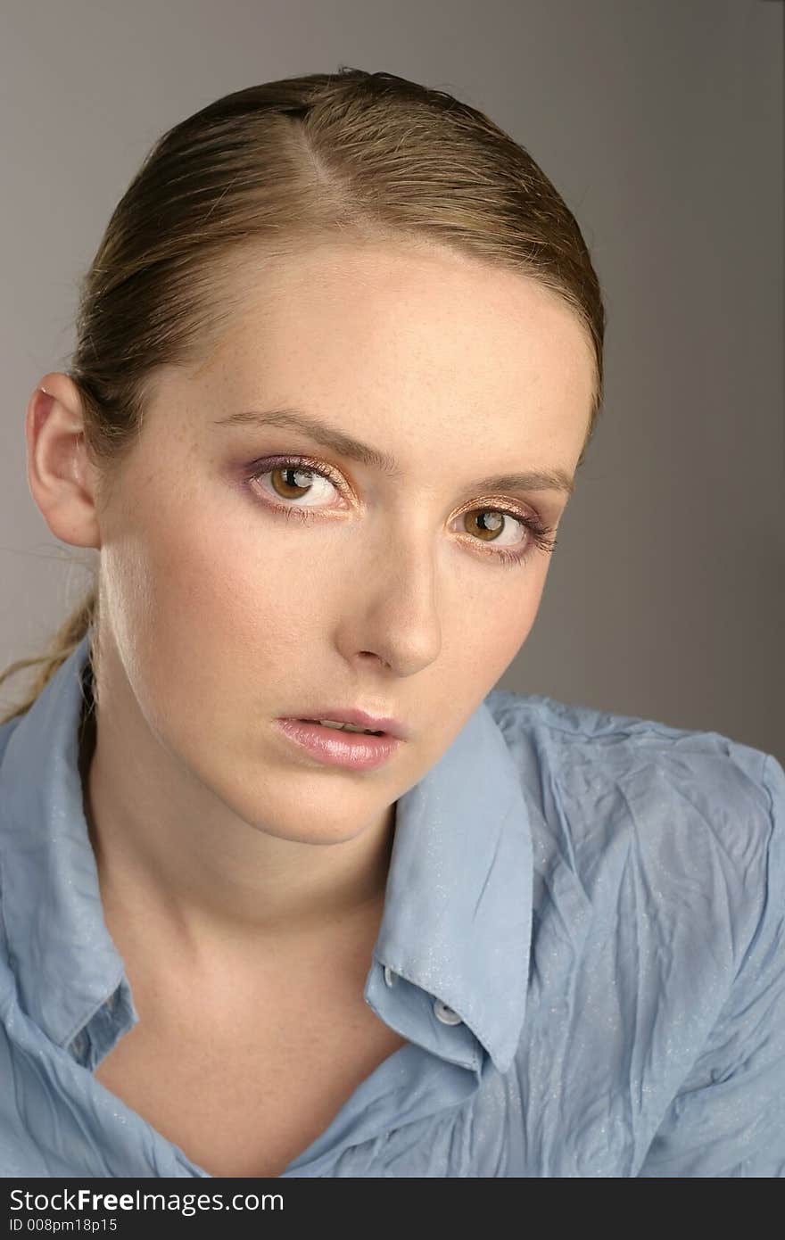 Young girl, woman in a blue blouse-portrait