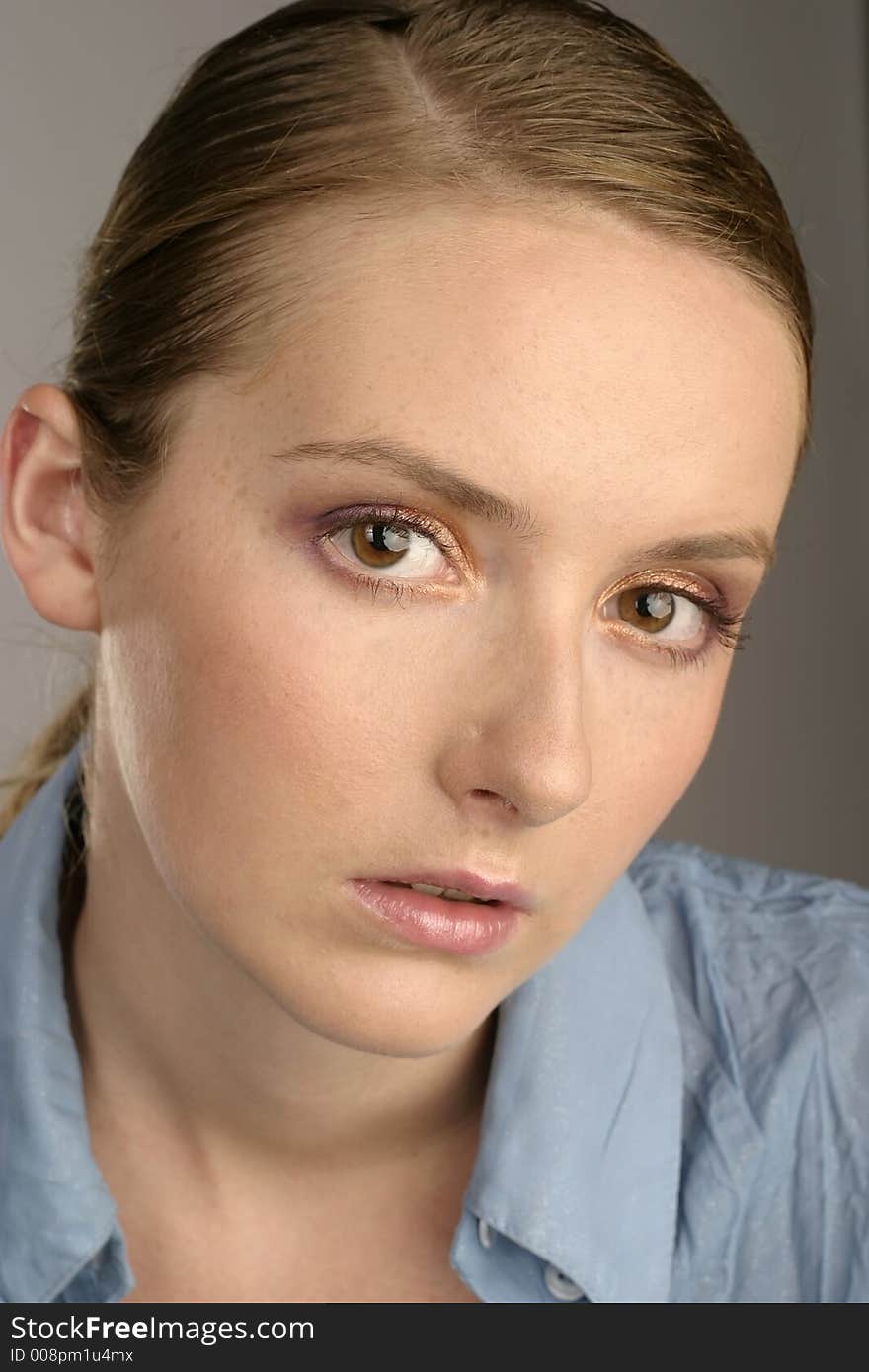 Young girl, woman in a blue blouse-portrait