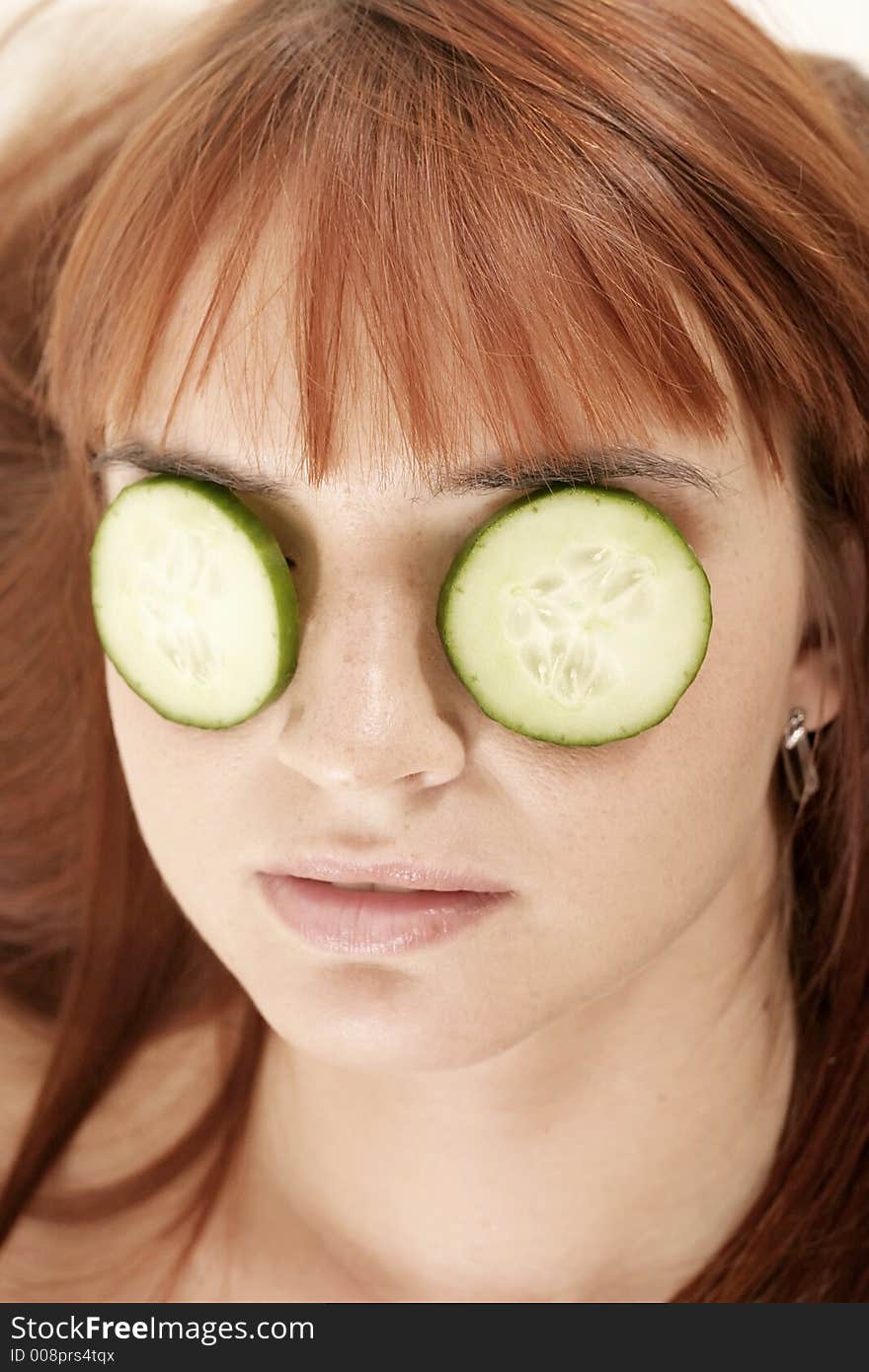 Red-haired young girl, woman with beauty-mask