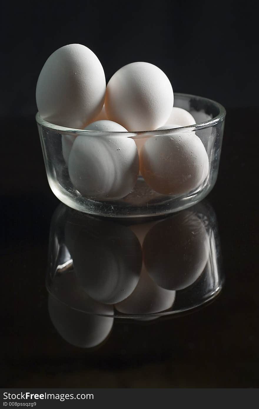 Seven eggs on a glass bowl. Seven eggs on a glass bowl