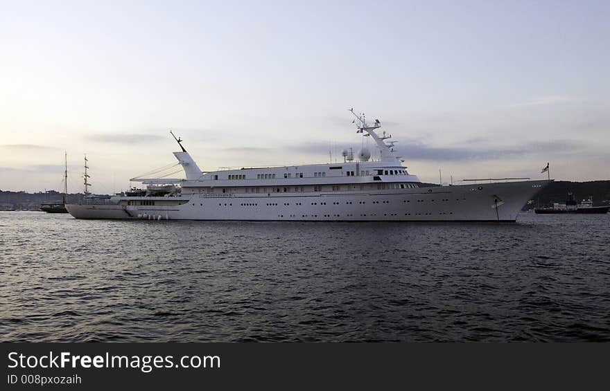 Motor yacht Atlantis II 115m long from 1981 in early morning light, moored in the bay of St-Tropez