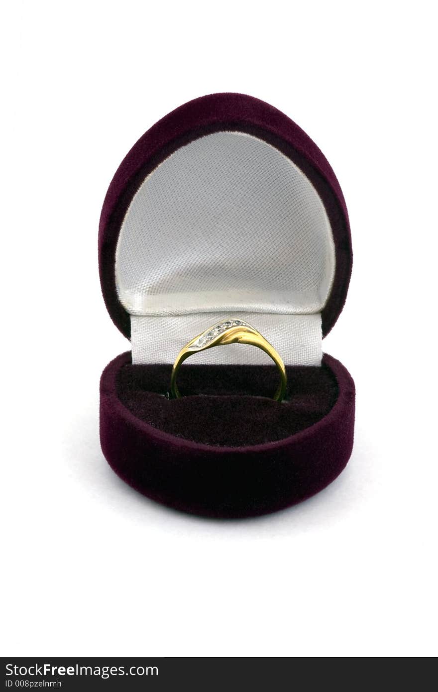 Golden female ring in the velvet case.