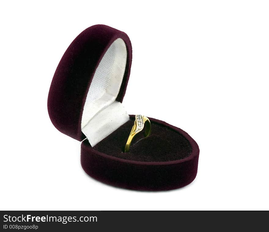 Golden female ring in the velvet case.