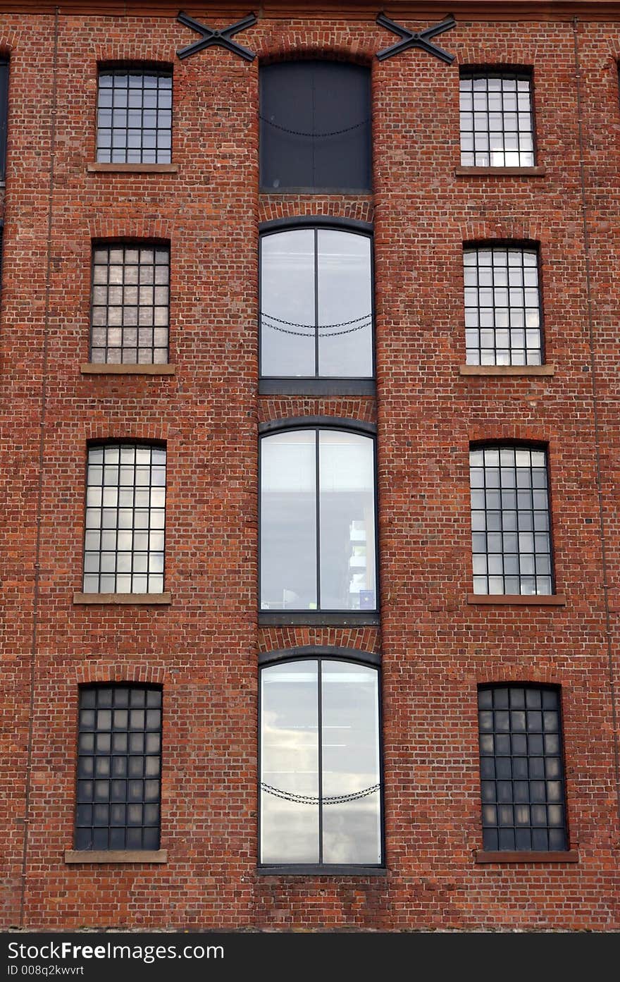 Windows in a brick, dockside warehouse in Liverpool, Merseyside, UK. Windows in a brick, dockside warehouse in Liverpool, Merseyside, UK.