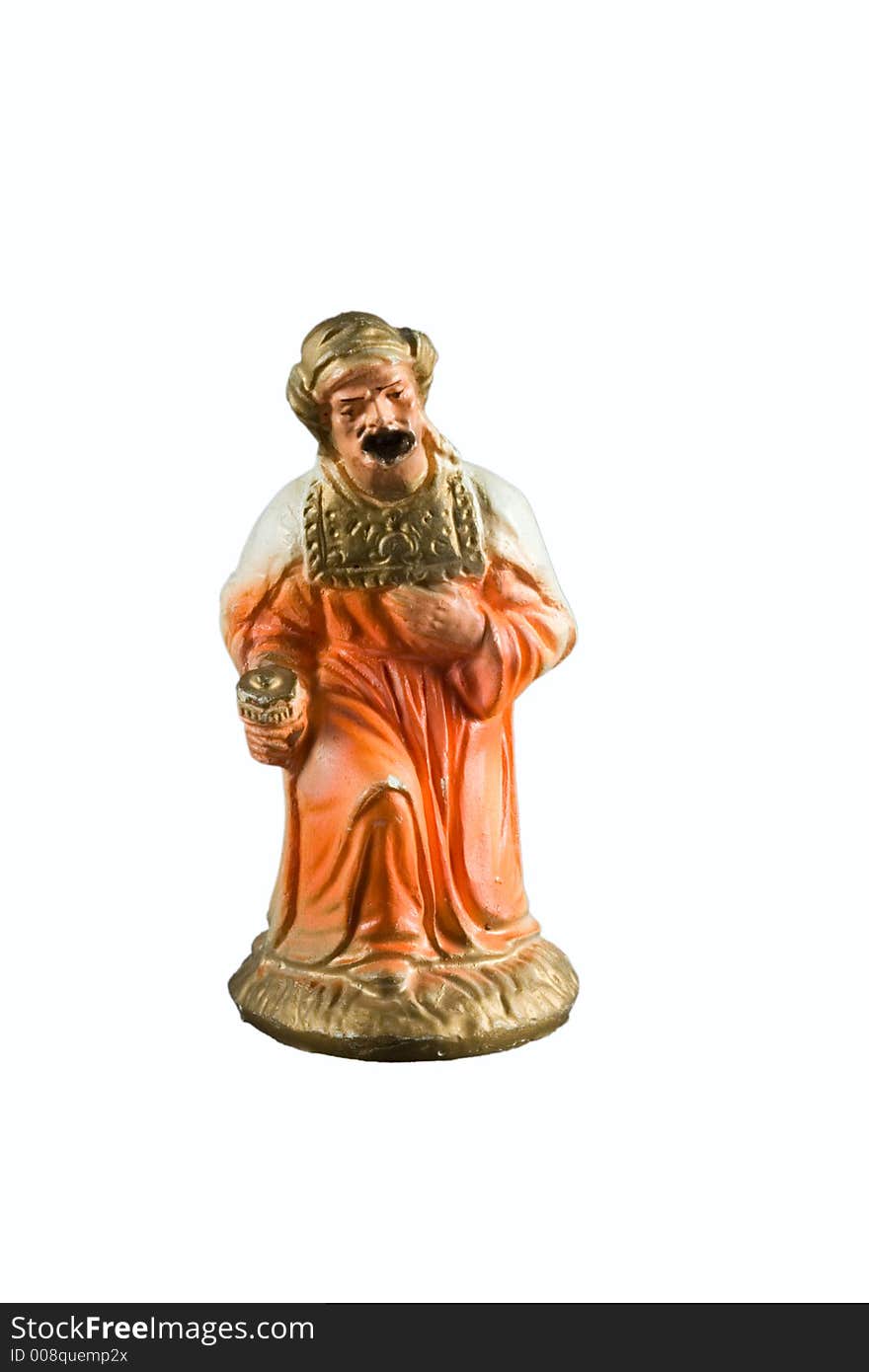 Orange wise man figurine from a nativity set. Orange wise man figurine from a nativity set