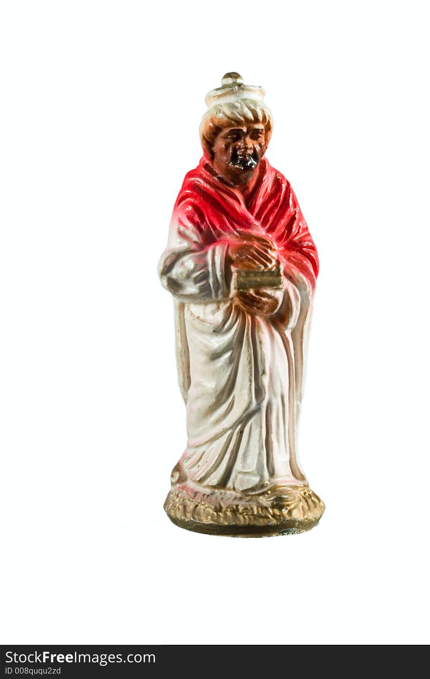 Red wise man figurine from a nativity set. Red wise man figurine from a nativity set