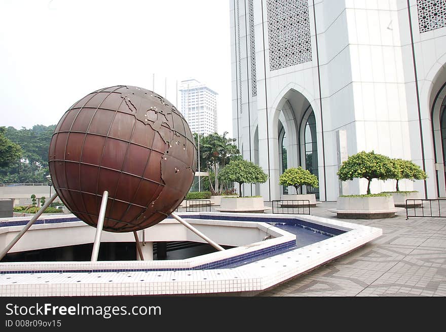 Globe infront a building showing america continent. Globe infront a building showing america continent