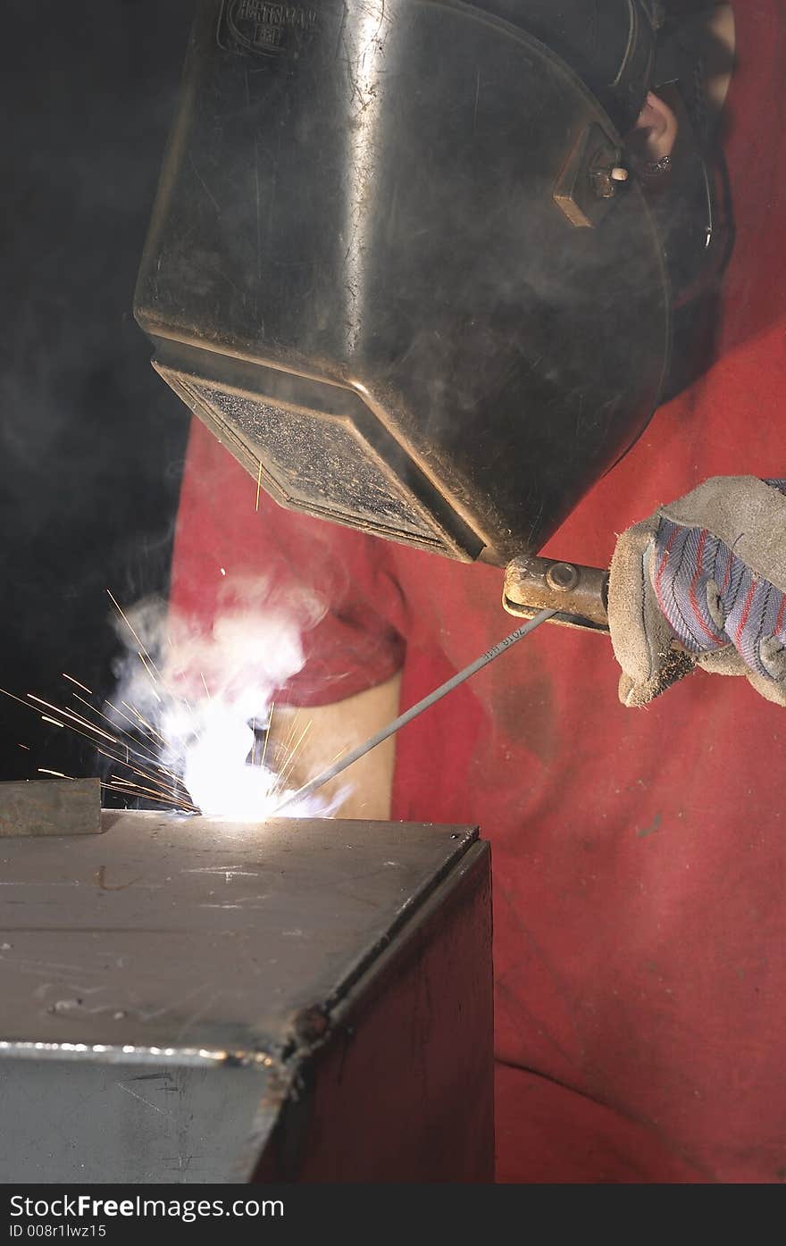 Close view of welder with red shirt. Close view of welder with red shirt