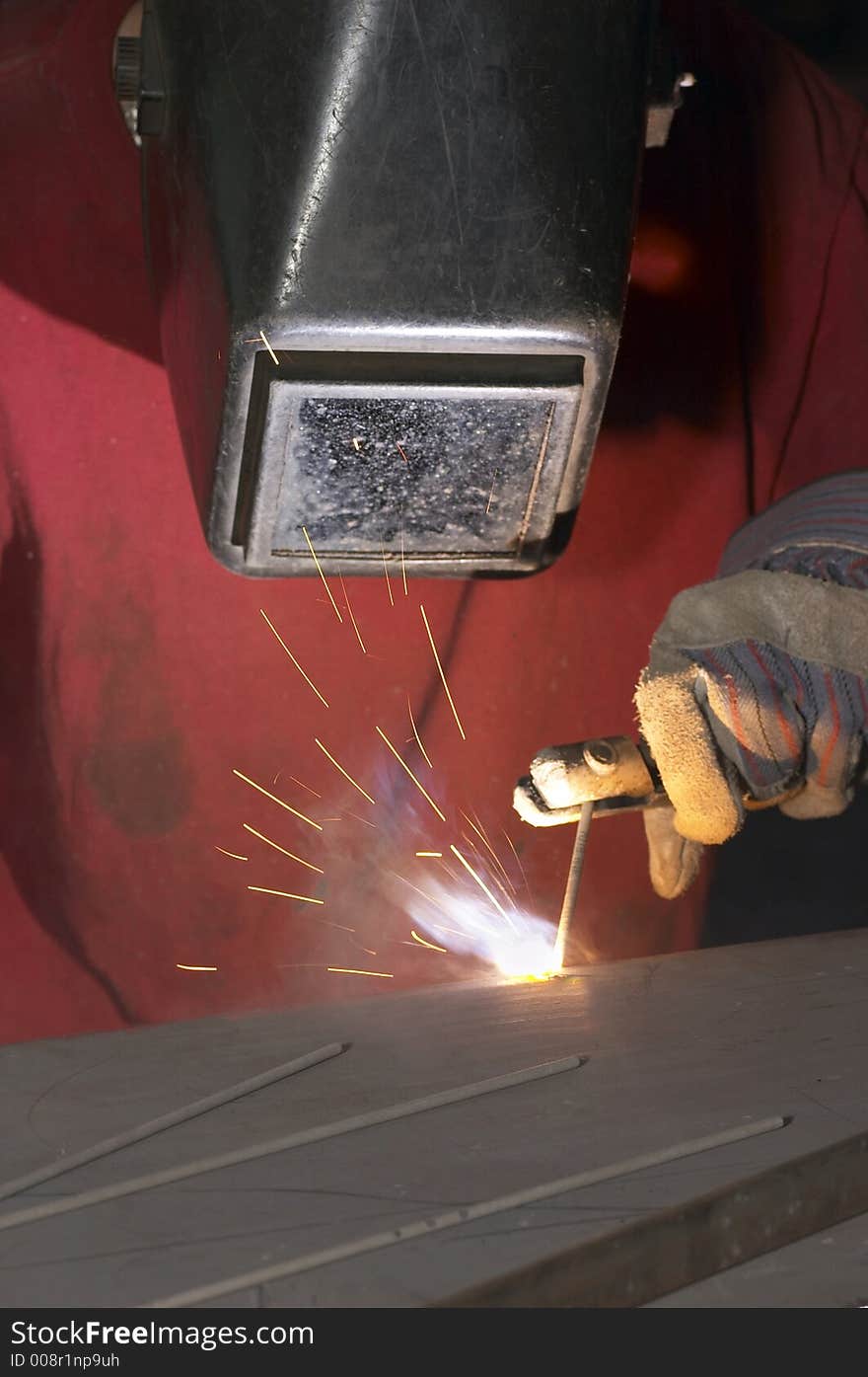 Close view of welder with red shirt. Close view of welder with red shirt