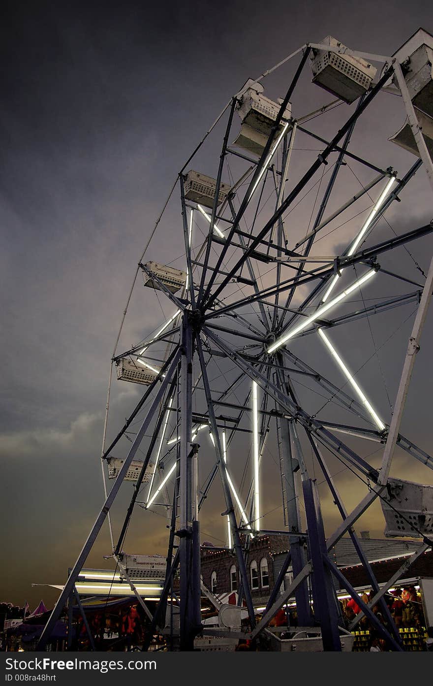 Ferris wheel at a small-town carnival. Ferris wheel at a small-town carnival.