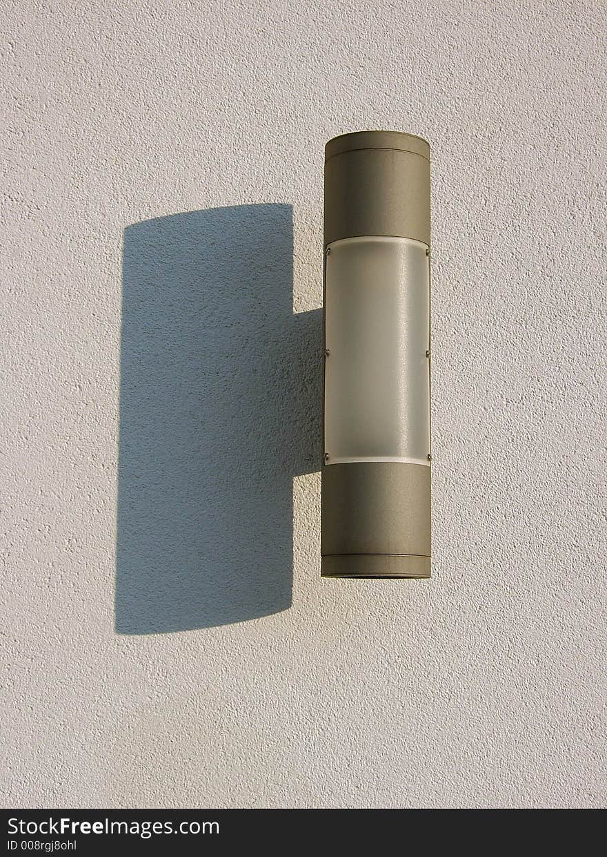 Light in the wall illuminated by sun