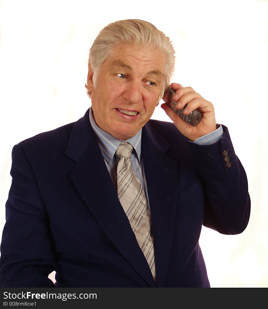 Talking on the telephone senior person with tie. Talking on the telephone senior person with tie