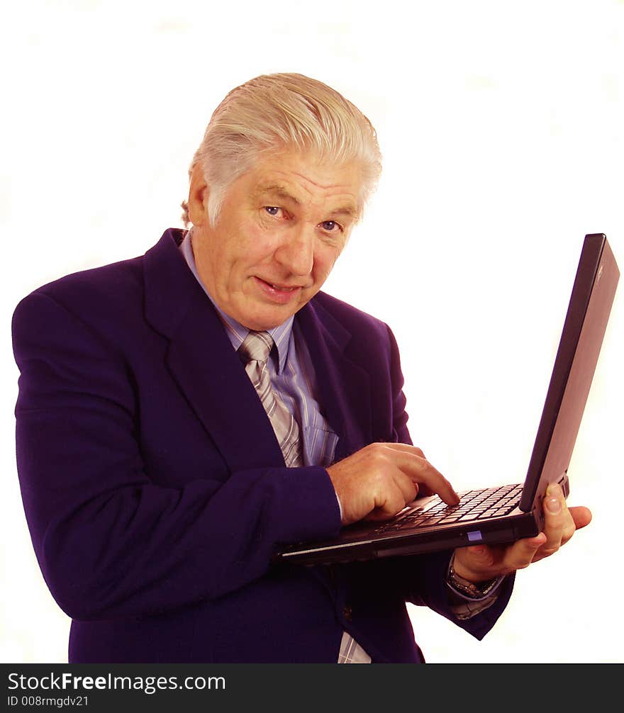 Senior person communicating through his laptop computer. Senior person communicating through his laptop computer