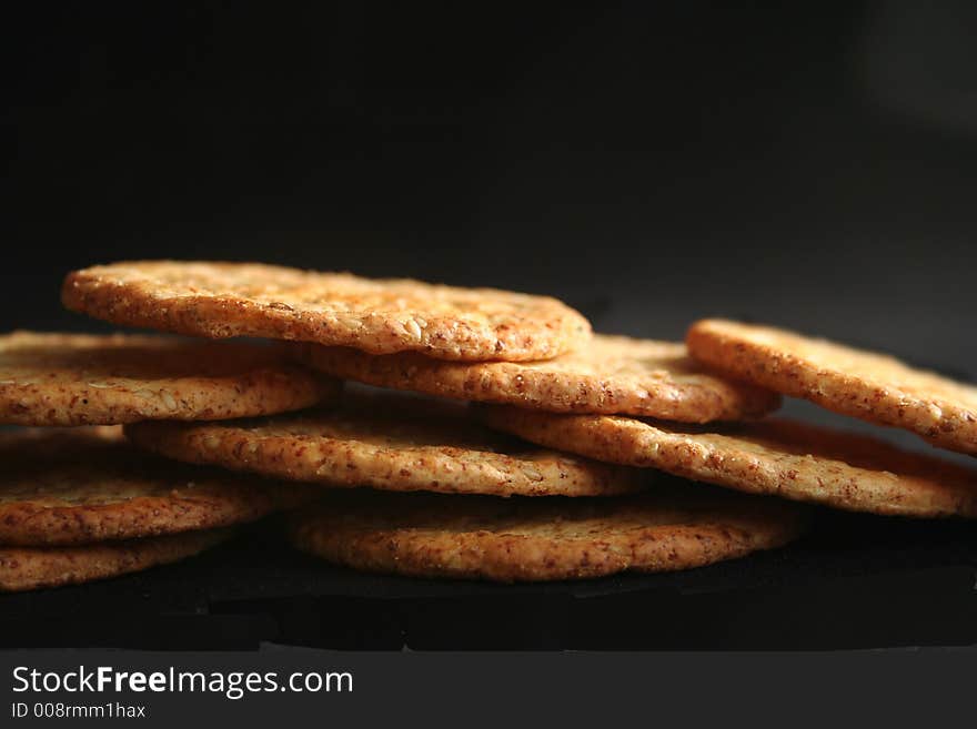 A bunch of crackers over black background