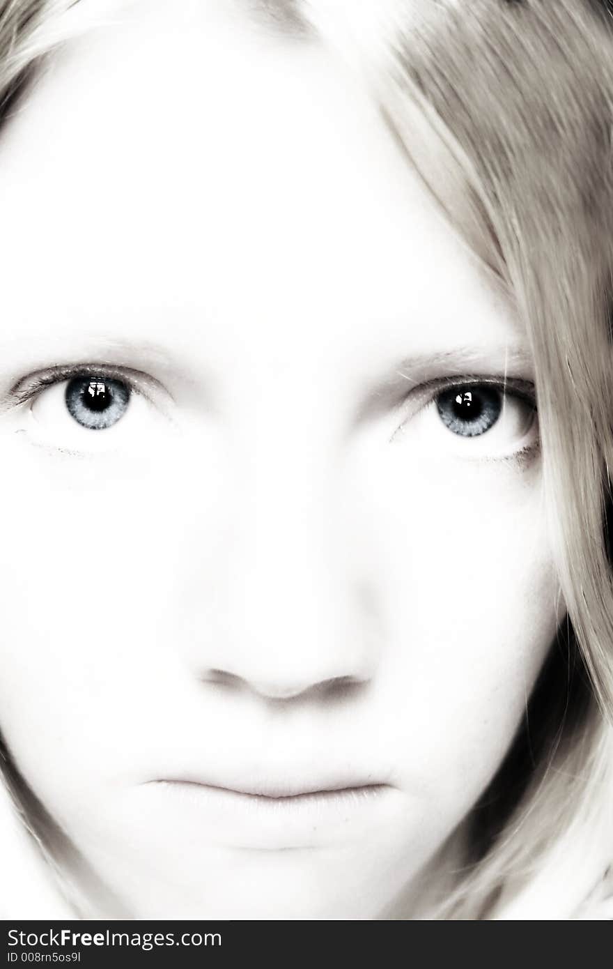 Portrait of a young blond woman with beautiful blue eyes. Portrait of a young blond woman with beautiful blue eyes