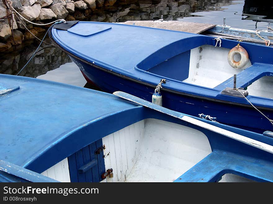 Two blue boats waiting for fishermen. Two blue boats waiting for fishermen