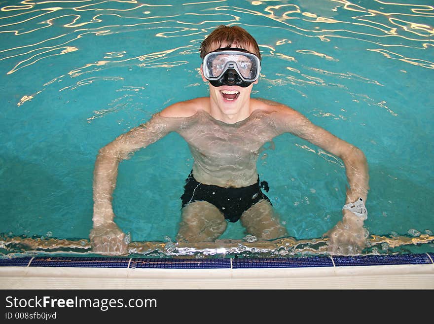 Happy man with mask in pool. Happy man with mask in pool