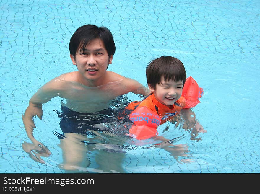 Man & Boy In The Pool