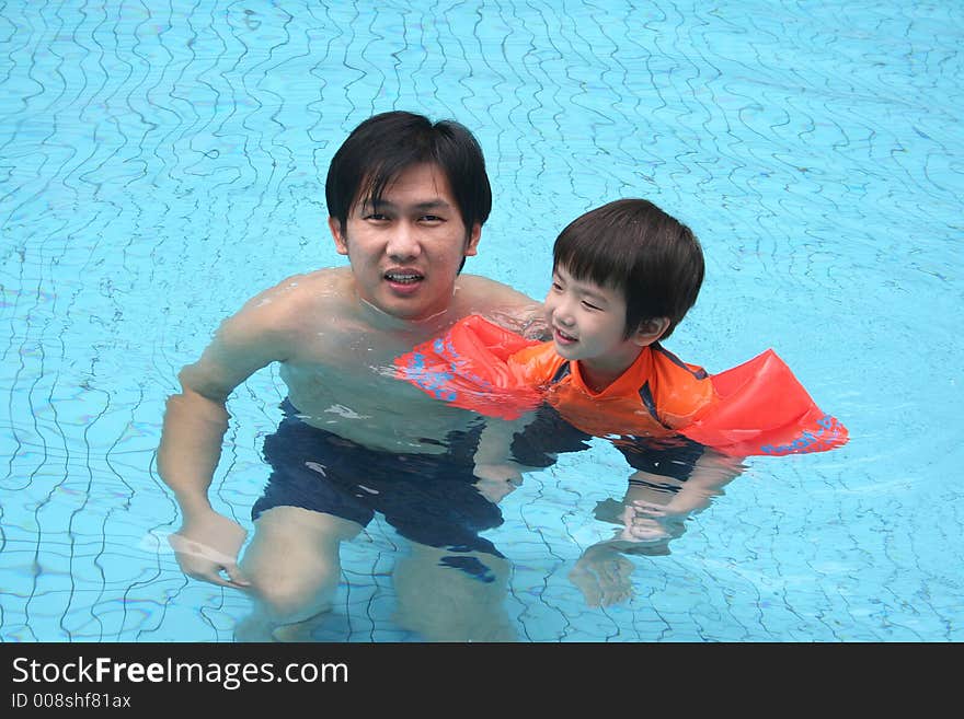 Man & Boy In The Pool