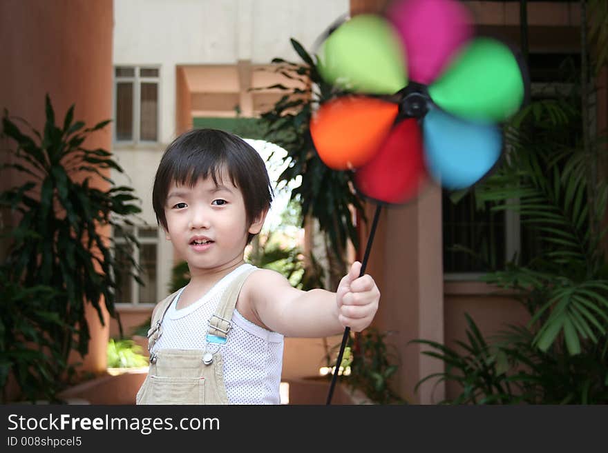 Boy & colorful spinning windmill