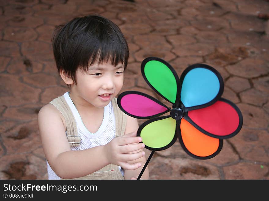 Boy & colorful windmill