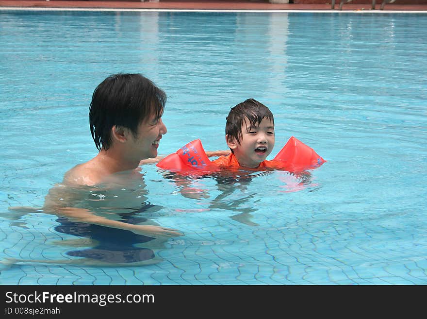 Man & Boy In The Pool