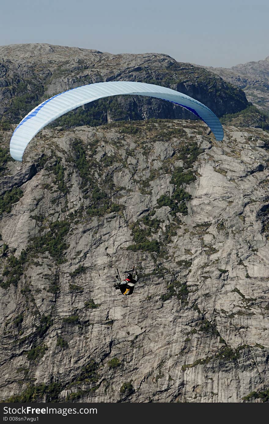 Picture of paraglider flying over Lysefjord in Norway. Picture of paraglider flying over Lysefjord in Norway.