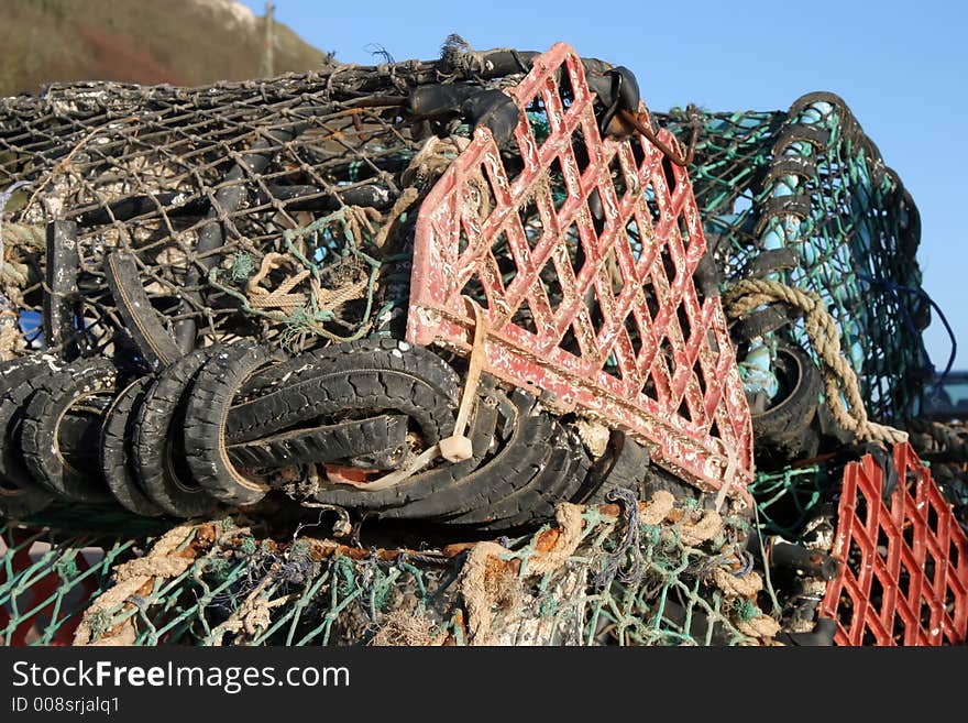 Lobster pots on the dockside at Seaton, Devon.