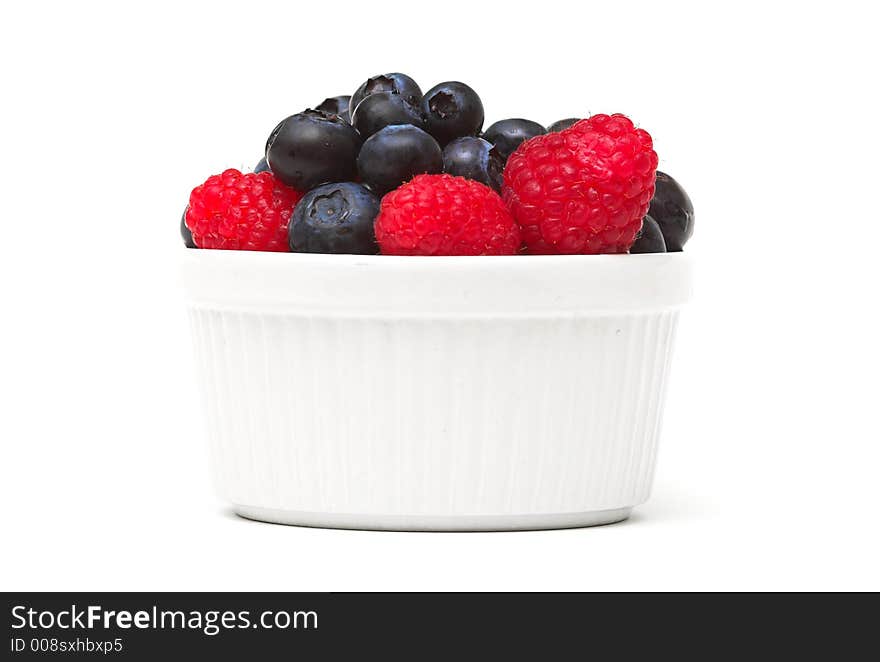 Raspberries and blueberries in a bowl. Raspberries and blueberries in a bowl