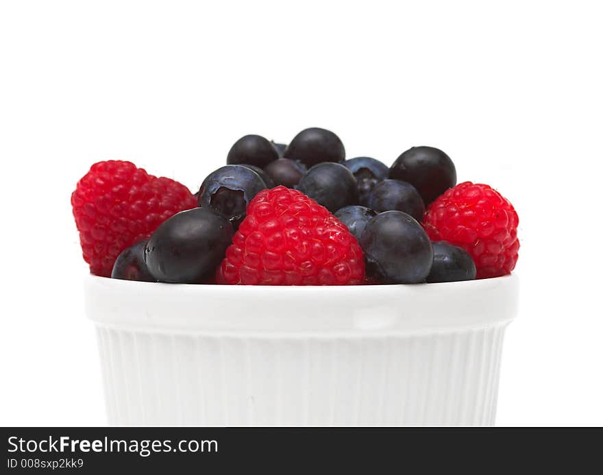 Raspberries and blueberries in a bowl. Raspberries and blueberries in a bowl