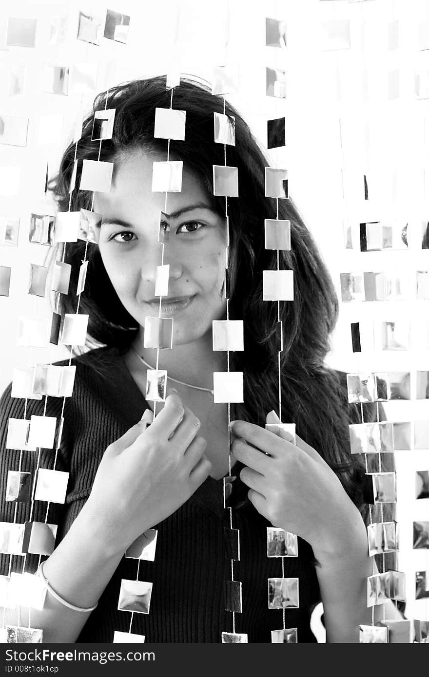 Woman behind mirrored beads