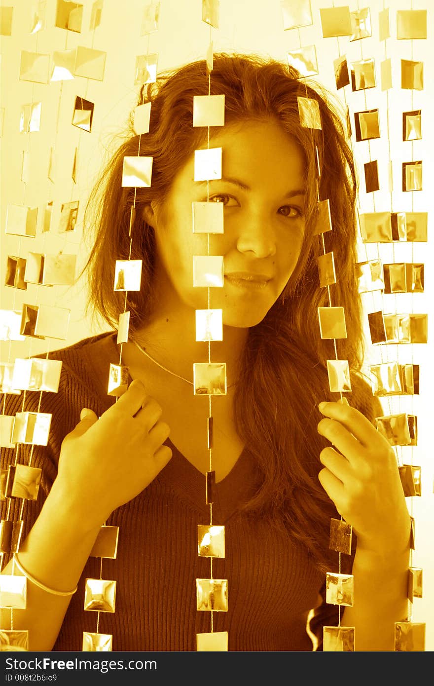 Woman behind mirrored beads