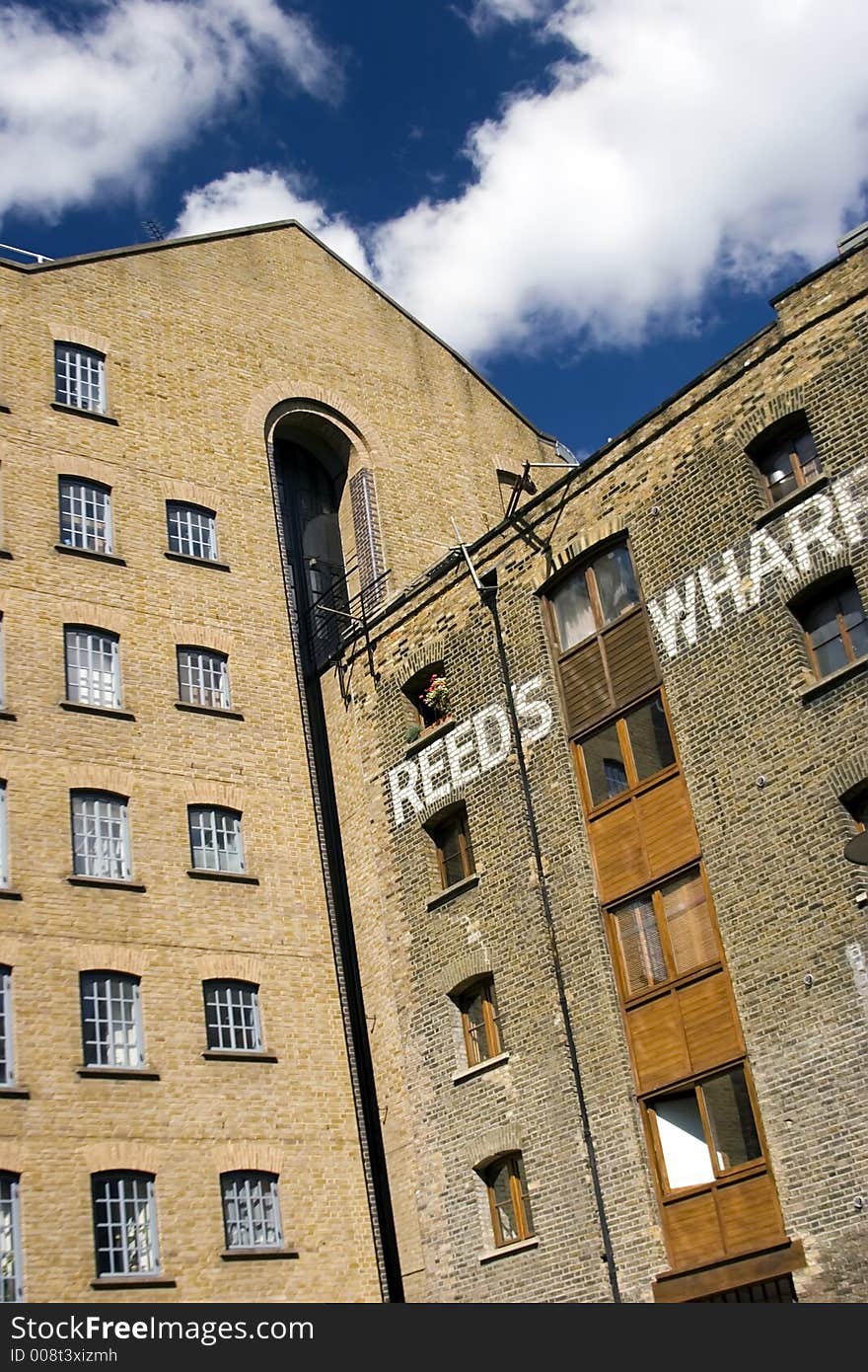 Modern converted warehouse along the river Thames, London.
