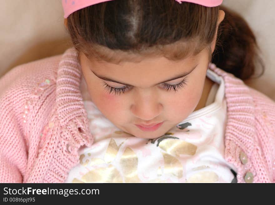 Portrait of child looking down. Portrait of child looking down