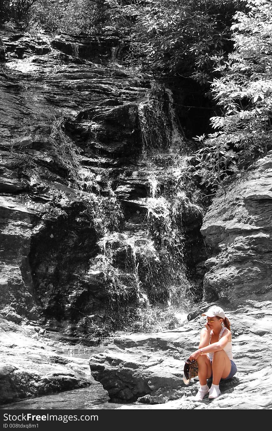 Woman by Black and White Waterfall